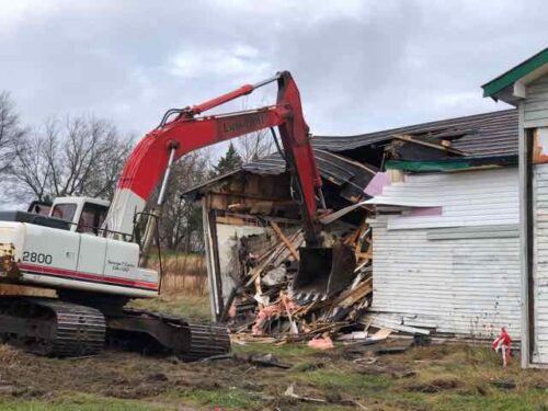 An excavator demolishes a building at George's Roadhouse. 