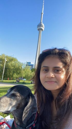 Selfie of permanent resident Marushka Loshki Nair with CN tower in the background