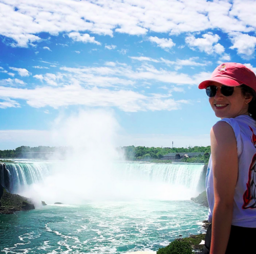 Photo of working holiday visa holder Florencia Lezcano looking back from Niagara Falls