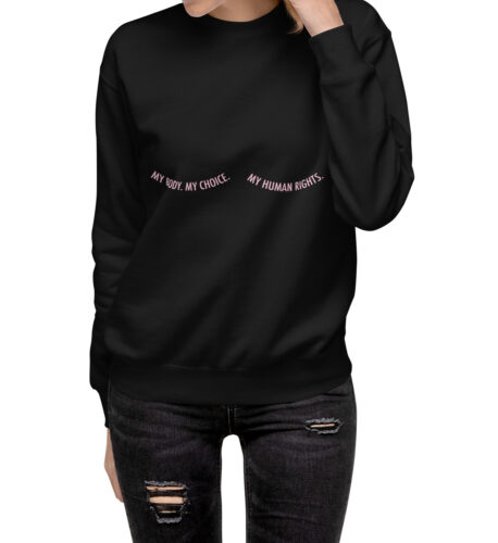 A woman is seen from the shoulders down, wearing a black pullover sweater with the words, "My body. My choice. My human rights."