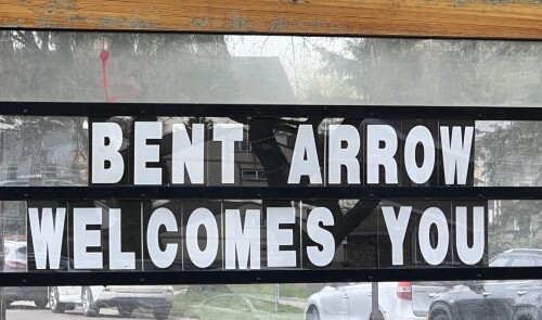 Image shows SIgn that says "Bent Arrow Welcomes You