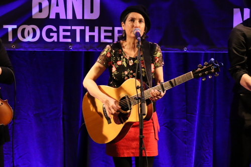 Image shows Maria Dunn performing on stage at JUNO Event