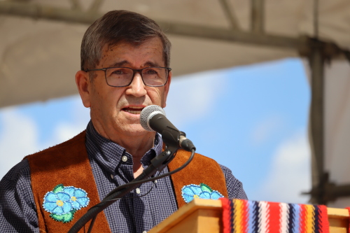 Image shows president of McMurray Métis Peter Hanson speaking at Métis Fest