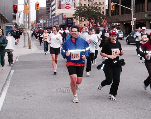 Labron's father is seen running the Toronto marathon in shorts with a group and a smile on his face.