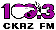 A purple, black and white logo for CKRZ CM 100.3 that shows an eagle clutching a feather in its mouth.