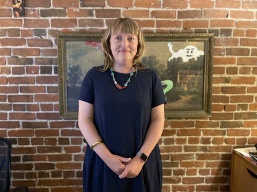 Picture of Martha Cooley Executive Director of the Atlantic International Film Festival smiling in her office.