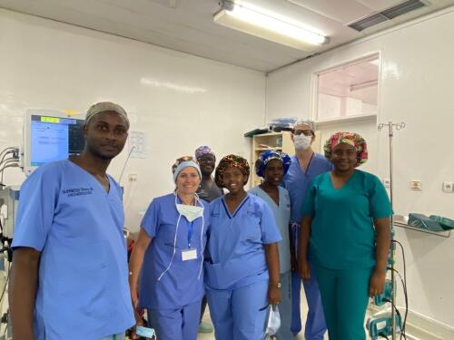 Photo of a team of doctors in scrubs at the ICU unit.