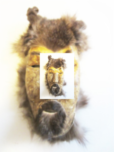 Aleutian Caribou Skim wind mask artisan artifact. There is a zoomed in photo on top of the other photo.