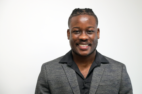 A professional portrait photo of communications director at Parkers Street Foodbank Romaine Rhoden.