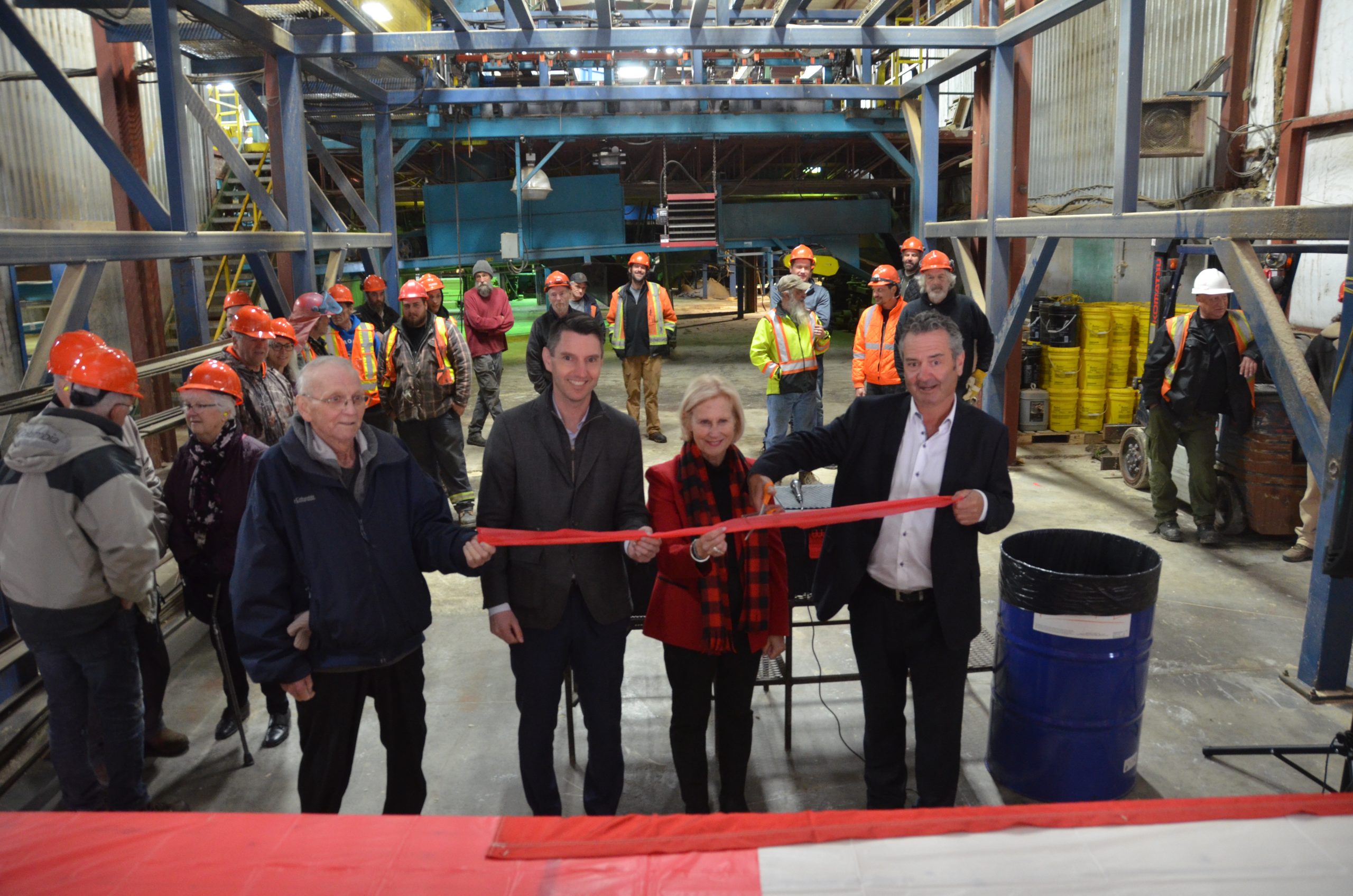 Ribbon cutting marks reopening of Commonwealth Plywood in Rapidesdes