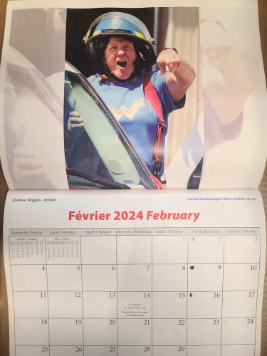 A page from a calendar featuring a female firefighter yelling.