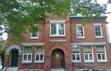 Pictured is the front of the Pettes Memorial Library. It is an old brick building that dates back