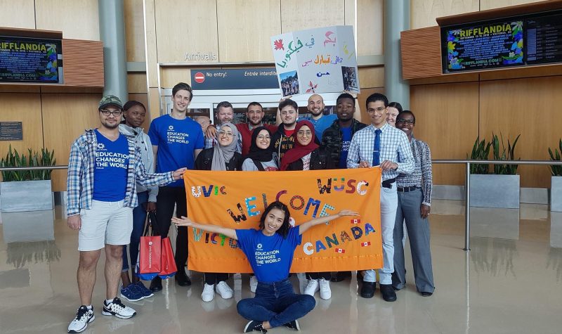 El-Musawi arriving in Victoria in 2018, greeted by the members of WUSC UVic.
