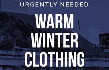 Poster on blue background that reads Urgently Needed, Warm winter clothing.