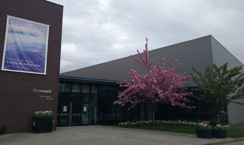 A photo of the outside of the reach gallery and museum. during springtime.