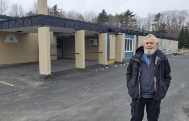 Eric Gouldon stands outside the former Milton Elementary School
