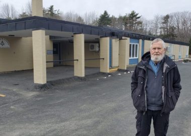 Eric Gouldon stands outside the former Milton Elementary School