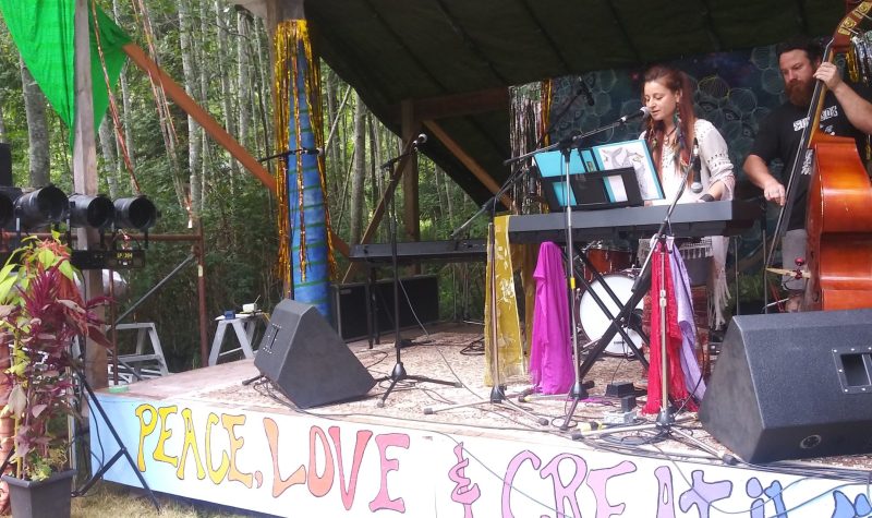 A vocalist and a stand up bassist perform on the Lovefest stage.