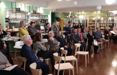 Pictured is the crowd at last night's press conference sitting down listening to a volunteer and/or member of the CAB Cowansville team.