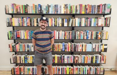 Owner Andrew Fitzpatrick standing in Take Cover Books' new store.