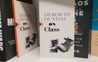 Two copies of On Class by Deborah Dundas on a shelf