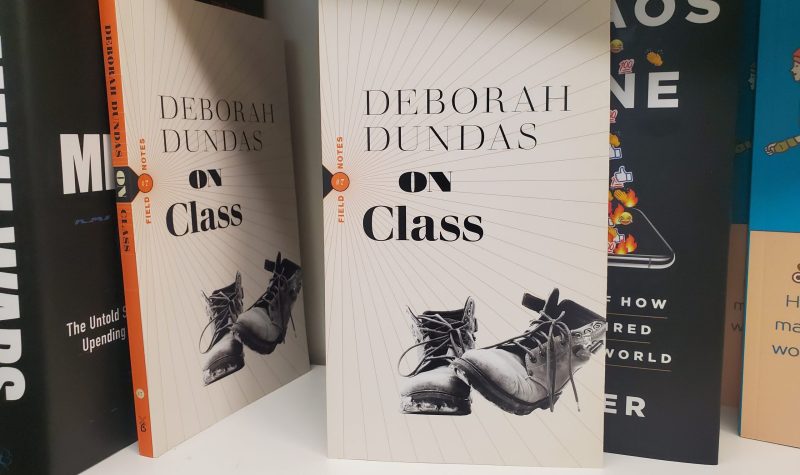 Two copies of On Class by Deborah Dundas on a shelf