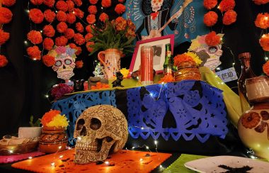 An altar with traditional Day of the Dead offerings, or ofrenda.