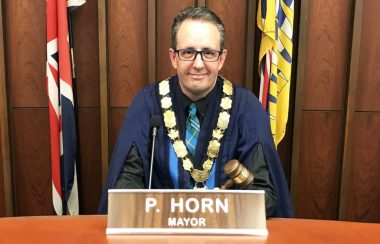 A photo of Mission Mayor Paul Horn behind a podium