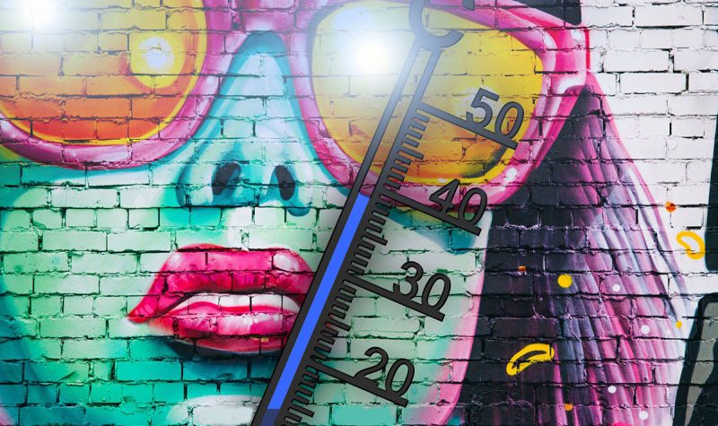 A photo of a mural in Abbotsford of a woman with sunglasses and a thermometer showing high heat