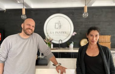 Pictured is Benoit (left) and Leila (right) standing in front of their main counter with their Le Pantry Knowlton logo.