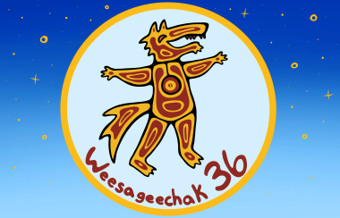 An Indigenous logo that is red and orange and shows a wolf is encircled in light blue in the middle of a light blue and dark blue rectangle. It is a festival logo.