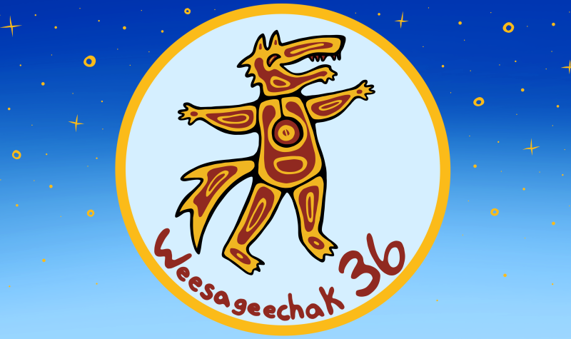 An Indigenous logo that is red and orange and shows a wolf is encircled in light blue in the middle of a light blue and dark blue rectangle. It is a festival logo.