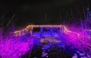 Pictured are the falls in Knowlton lit up for last year’s Midnight Madness event. There are white lights around the falls and they are also lit up in purple.