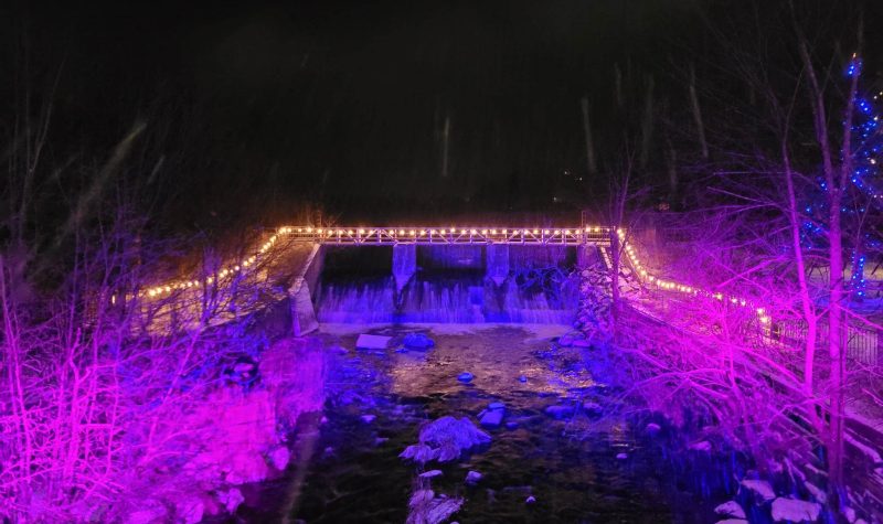 Pictured are the falls in Knowlton lit up for last year’s Midnight Madness event. There are white lights around the falls and they are also lit up in purple.