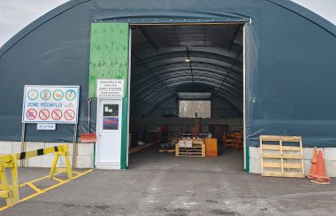 The front entrance to the reuse space. It is a dome-like structure with a large door. To the left of the entrance, there is the deposit station. It is identified using yellow blockers.