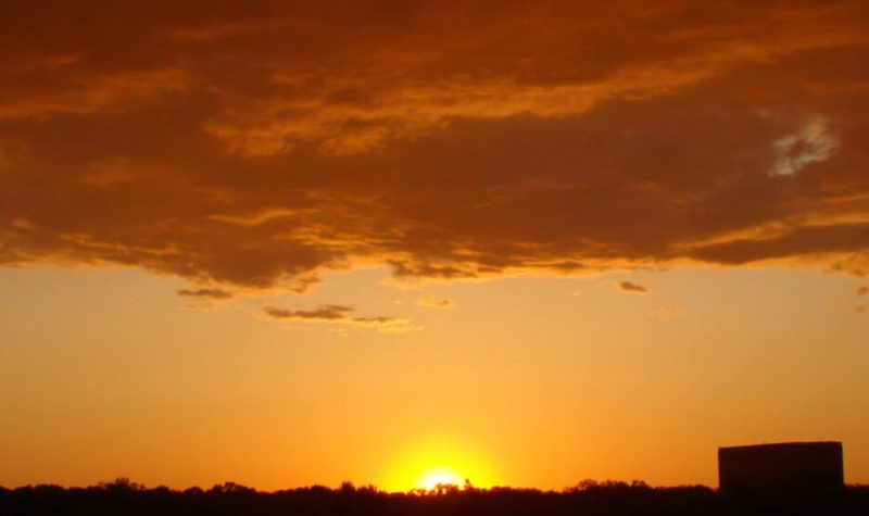 A picture of a yellow and orange sunset in a stock image by Flickr.