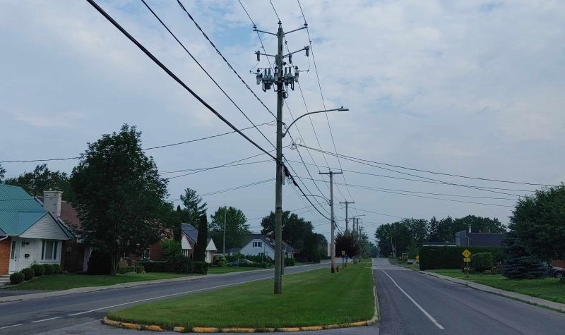 A horizontal photograph of hydro lines in the Eastern Townships.