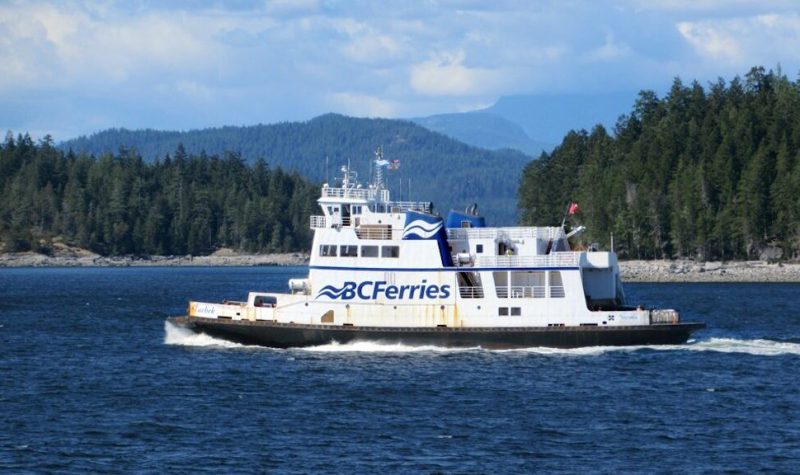 A BC Ferry is seen on the water on a sunny day off the coast of Vancouver.