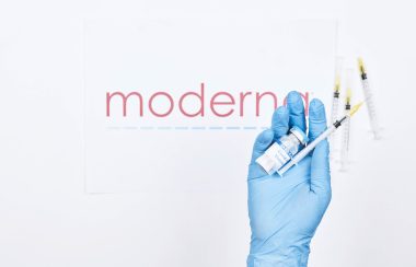 Doctor holds an injection with new Moderna vaccine