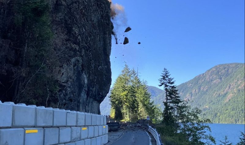 Boulders fall from a cliff onto Highway 4 near Cameron Lake