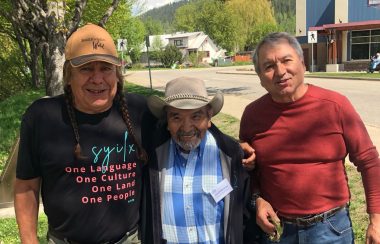 Three men standing together