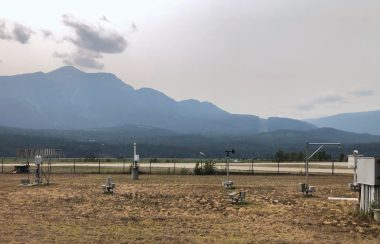 Weather instruments with mountains in the background.