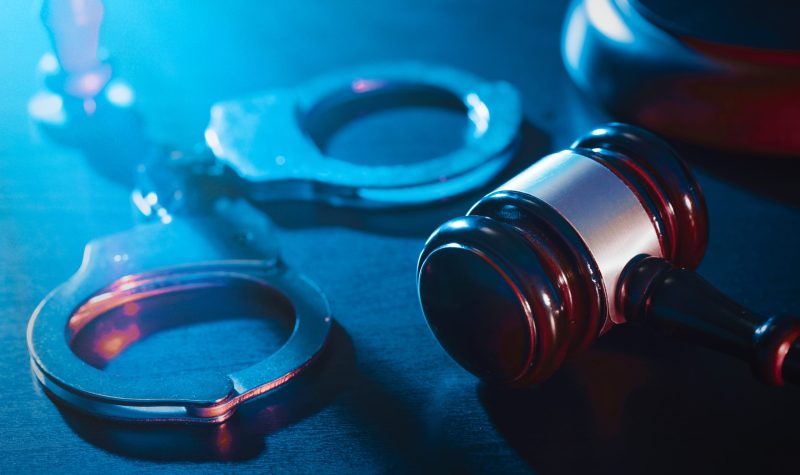 Stock image of handcuffs and gavel