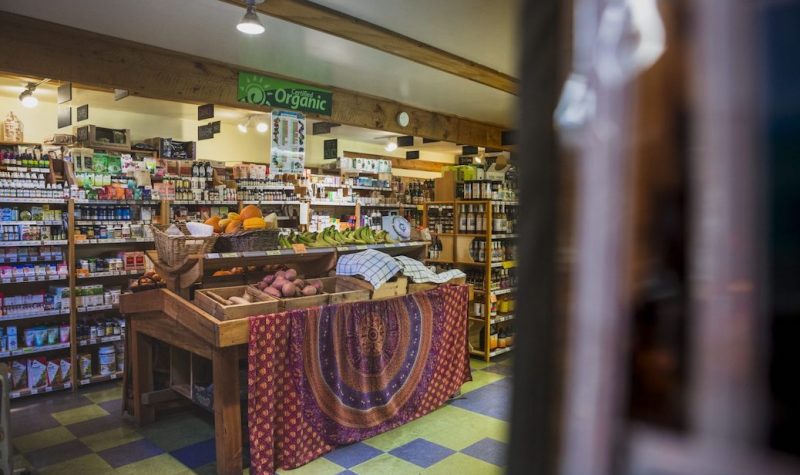 A photo of a stand at the Cortes Natural Food Co-op.
