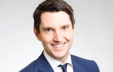 A professional headshot of Pontiac MNA André Fortin, wearing a blue suit and tie and a white shirt.