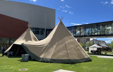 Image shows Dual Tee Pee Tents on for Indigenous Artisan Market on a sunny day.