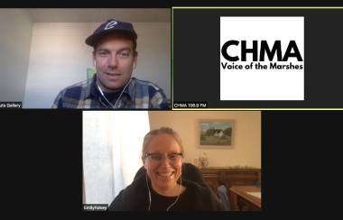 A zoom screenshot of two people talking on video chat and a third person off screen represented by a white and black CHMA logo