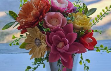 Life-like sola wood flowers are displayed in a bouquet in sunset colors.