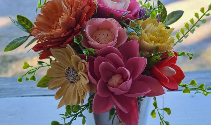 Life-like sola wood flowers are displayed in a bouquet in sunset colors.