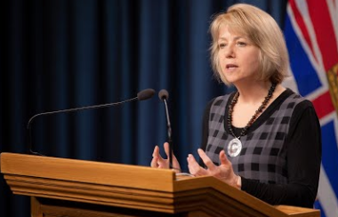 Dr. Bonnie Henry speaking at a podium during a press conference in B.C.